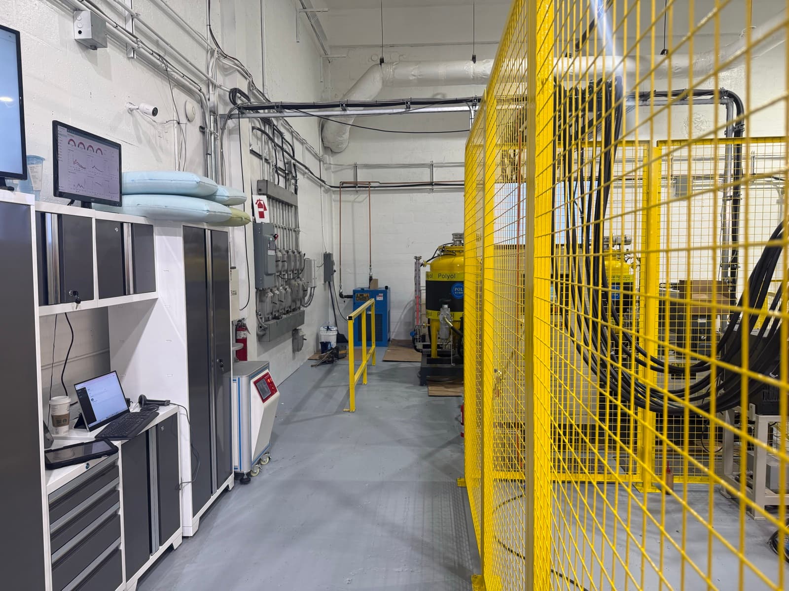Polyurethane chemistry station and finished pillows on shelves at the Saint-Jean-sur-Richelieu, Quebec facility.